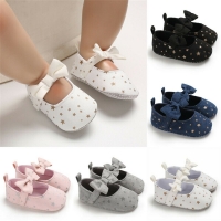 Baby girl and boy soft sole shoes with bowknot and dot print for crib and casual wear.