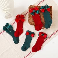 Red Knee-High Christmas Socks with Big Bow for Baby Girls: Soft Cotton, 0-5 Years, Ideal Gift.