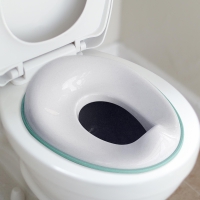 Space-saving kids toilet training seat fits round and oval toilets